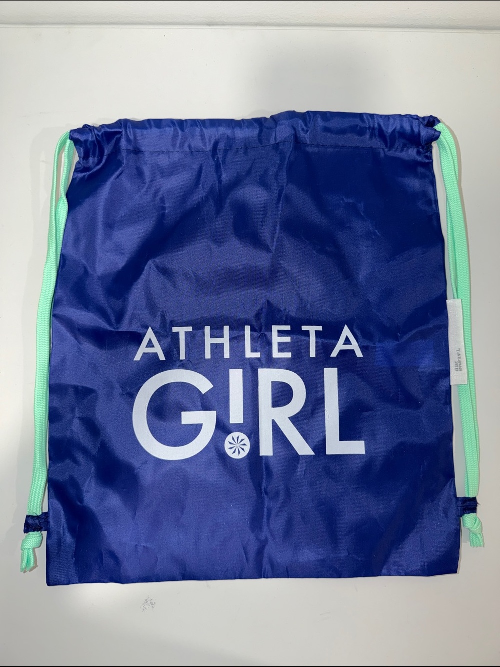 ATHLETA GIRL BLUE TEAL WHITE STRING BAG